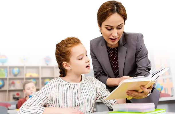 Educator supporting a student in the classroom